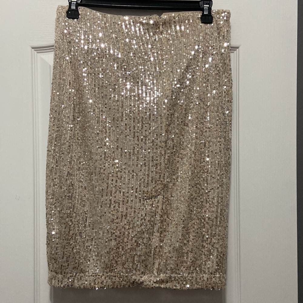 DKNY sequined skirt in a size 4. Brand new with tags. Gold.